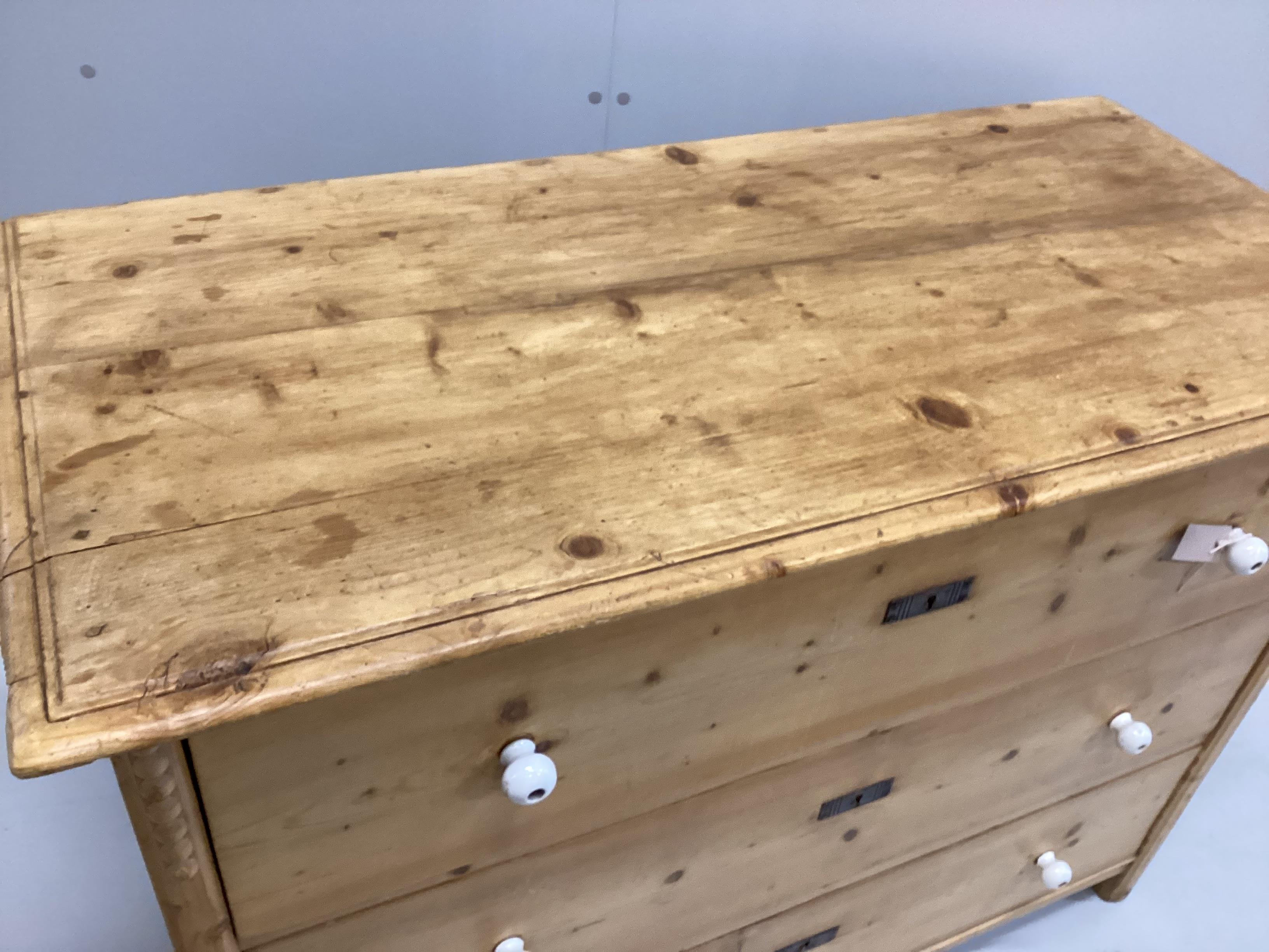 A 19th century East European pine three drawer chest, width 124cm, depth 58cm, height 93cm